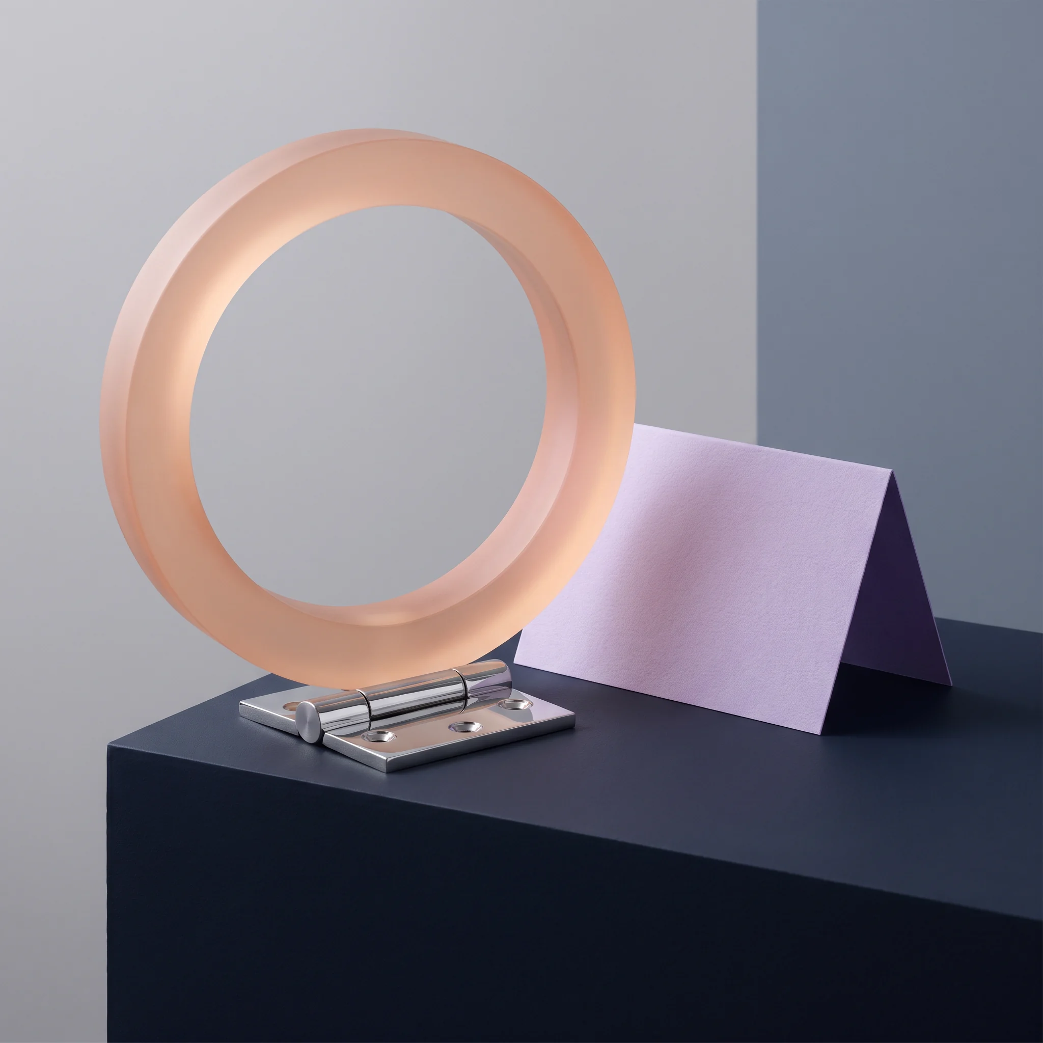A circular peach sculpture on a small metal stand
